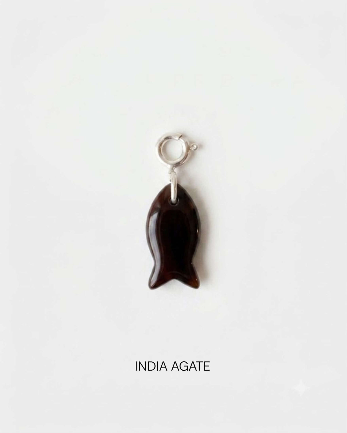 Fish Charm Small made of India Agate, featuring a sleek and organic design perfect for elegant styling.