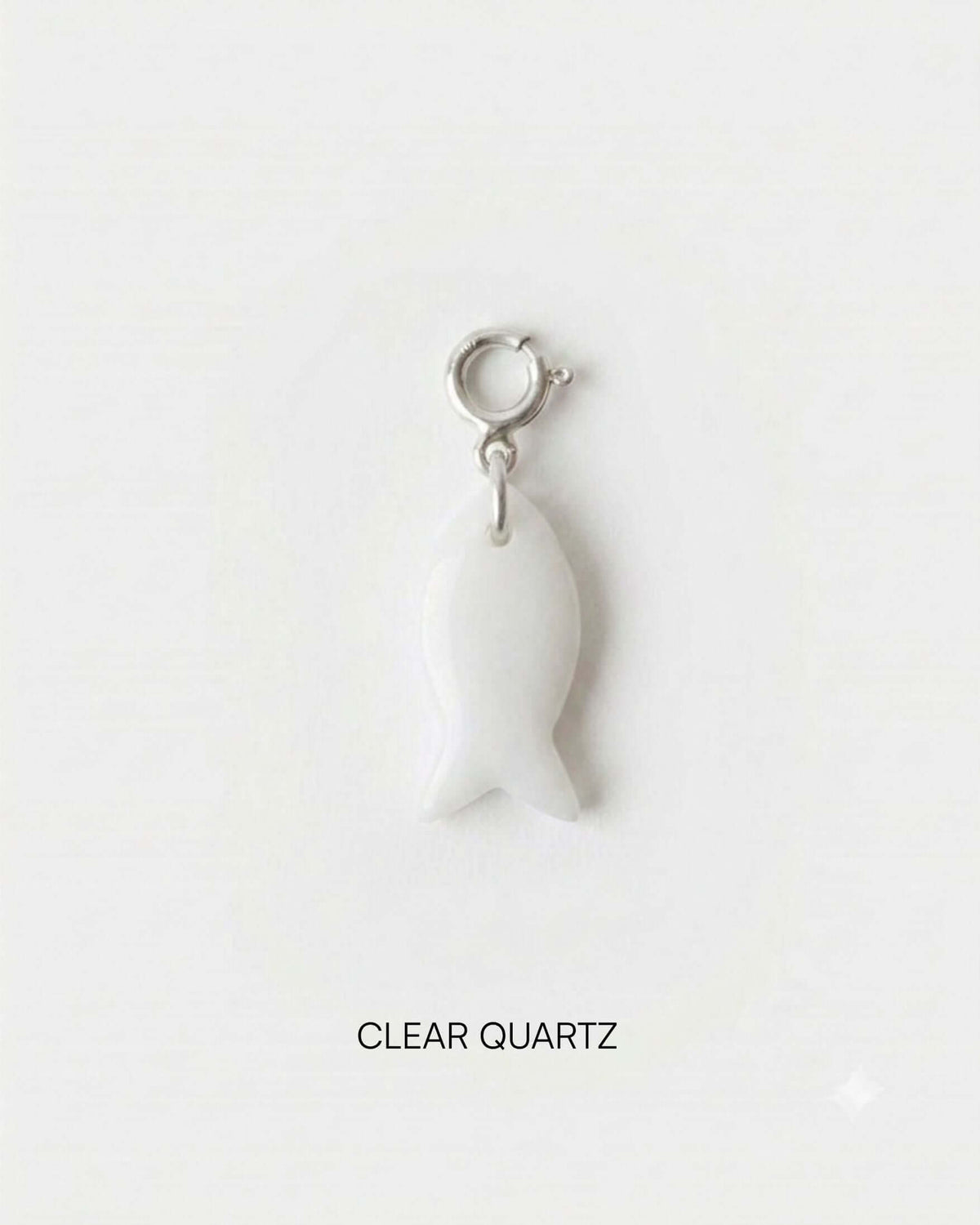 Fish Charm Small made of clear quartz, shaped like a fish, ideal for versatile jewelry styling.